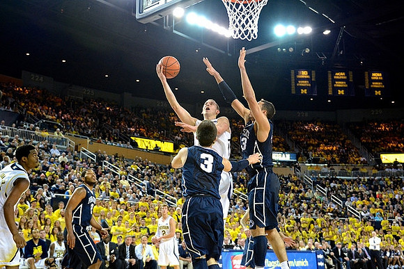 Derrick Walton Jr. (10), Spike Albrecht (2), and Nik Stauskas (11)