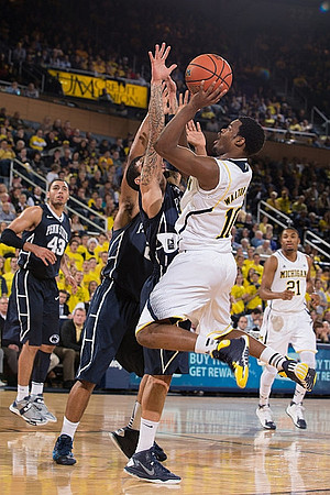 Derrick Walton Jr. (10) and Zak Irvin (21)