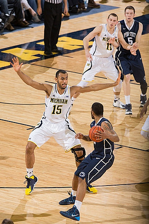 Jon Horford (15) and Nik Stauskas (11)
