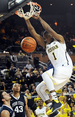 Glenn Robinson III (1) and Derrick Walton Jr. (10)
