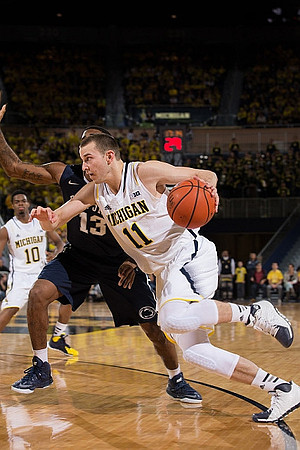 Derrick Walton Jr. (10) and Nik Stauskas (11)