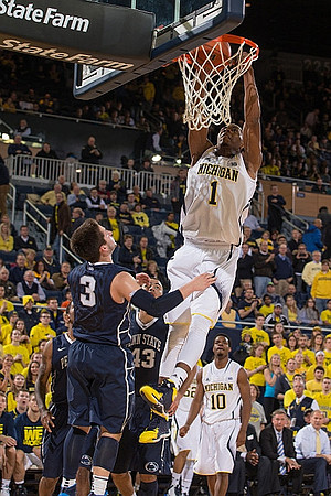 Glenn Robinson III (1) and Derrick Walton Jr. (10)