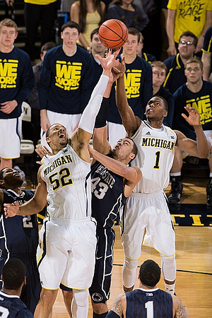 Jordan Morgan (52) and Glenn Robinson III (1)