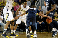 Jon Horford (15) and Derrick Walton Jr. (10)