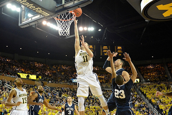 Jon Horford (15) and Nik Stauskas (11)