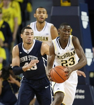 Caris LeVert (23) and Jon Horford (15)