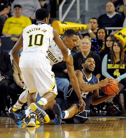 Derrick Walton Jr. (10) and Glenn Robinson III (1)