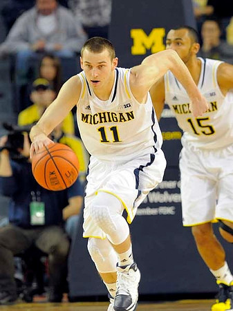 Nik Stauskas (11) and Jon Horford (15)