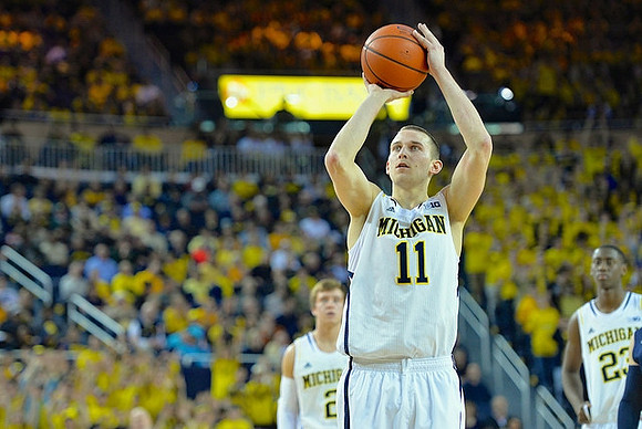 Nik Stauskas (11), Spike Albrecht (2), and Caris LeVert (23)