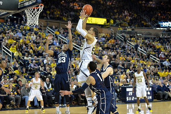 Spike Albrecht (2), Jordan Morgan (52), and Caris LeVert (23)