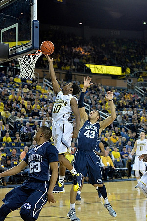 Derrick Walton Jr. (10) and Nik Stauskas (11)
