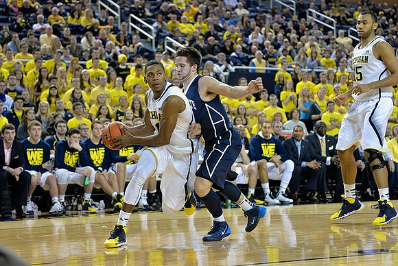 Glenn Robinson III (1) and Jon Horford (15)