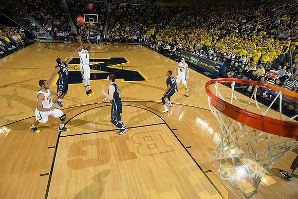 Jon Horford (15), Glenn Robinson III (1), and Nik Stauskas (11)