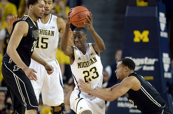 Jon Horford (15) and Caris LeVert (23)