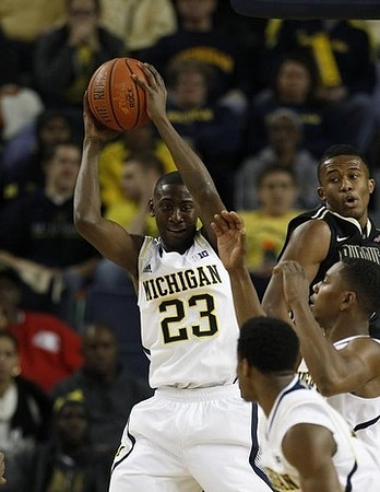 Caris LeVert (23), Derrick Walton Jr. (10), and Glenn Robinson III (1)