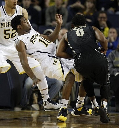 Jordan Morgan (52) and Derrick Walton Jr. (10)