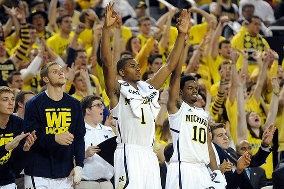 Mark Donnal (34), Max Bielfeldt (44), Glenn Robinson III (1), Derrick Walton Jr. (10), Mitch McGary (4), and C.J. Lee