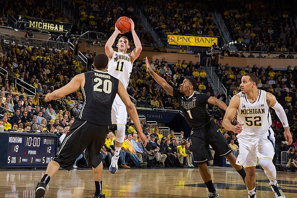 Nik Stauskas (11) and Jordan Morgan (52)
