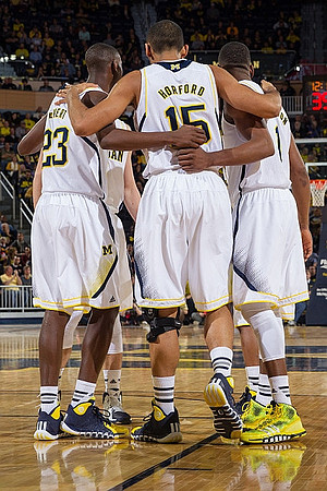 Caris LeVert (23), Jon Horford (15), and Glenn Robinson III (1)