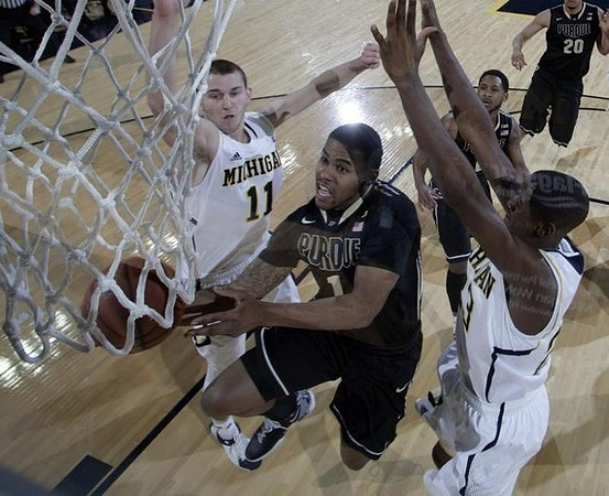 Nik Stauskas (11) and Caris LeVert (23)