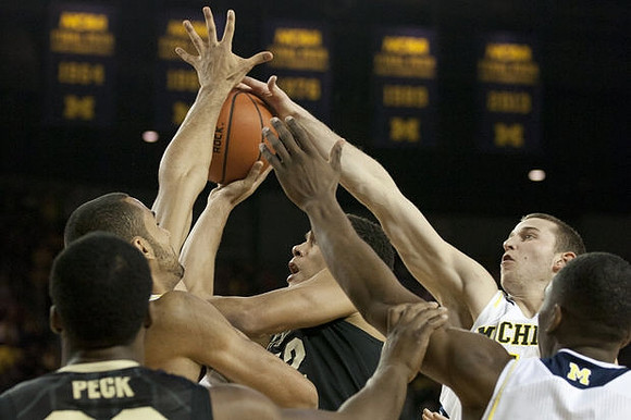 Jon Horford (15), Nik Stauskas (11), and Glenn Robinson III (1)
