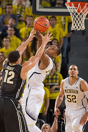 Glenn Robinson III (1) and Jordan Morgan (52)