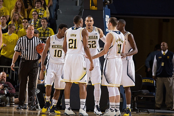 Derrick Walton Jr. (10), Zak Irvin (21), Jordan Morgan (52), Nik Stauskas (11), and Caris LeVert (23)