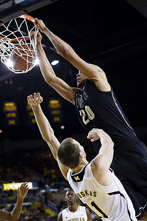 Nik Stauskas (11) and Caris LeVert (23)