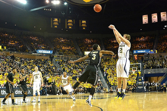Nik Stauskas (11), Zak Irvin (21), and Spike Albrecht (2)