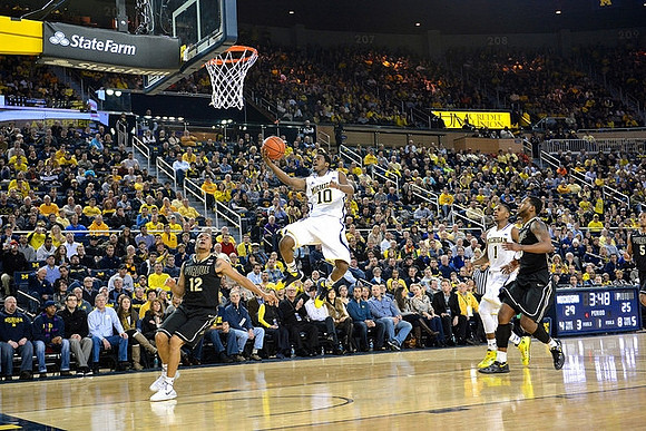 Derrick Walton Jr. (10) and Glenn Robinson III (1)