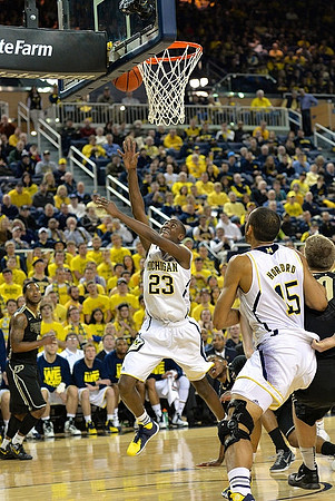 Caris LeVert (23) and Jon Horford (15)