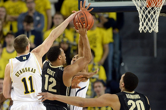 Nik Stauskas (11) and Jon Horford (15)