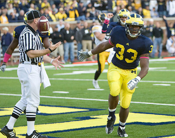 Martell Webb (80), Tate Forcier (5), and Stephen Hopkins (33)