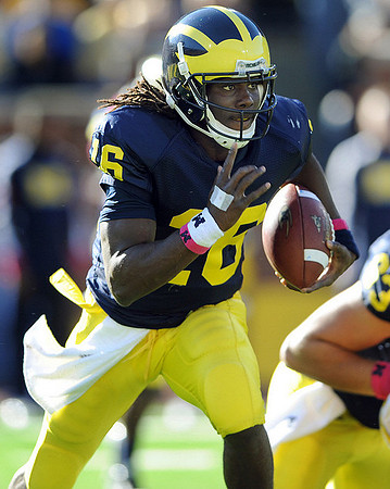 Denard Robinson (16) and Rocko Khoury (63)