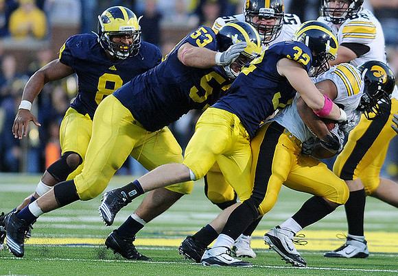 Jonas Mouton (8), Ryan Van Bergen (53), and Jordan Kovacs (32)