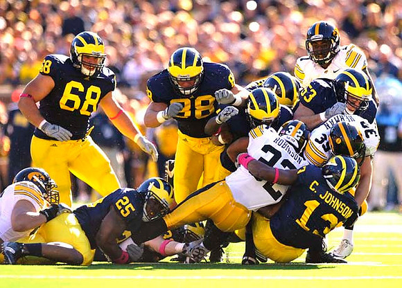 Mike Martin (68), Kenny Demens (25), Craig Roh (88), Ryan Van Bergen (53), and Carvin Johnson (13)