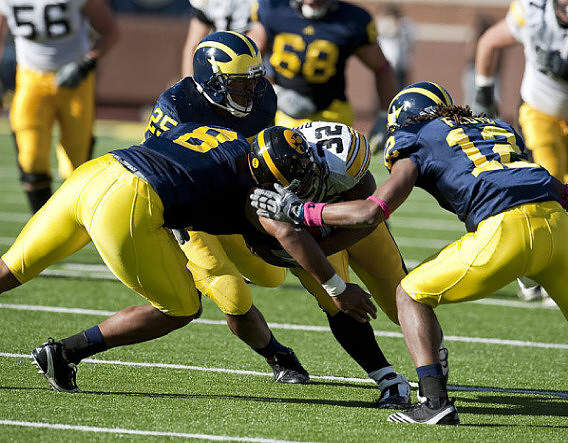 Kenny Demens (25), Jonas Mouton (8), and J.T. Floyd (12)