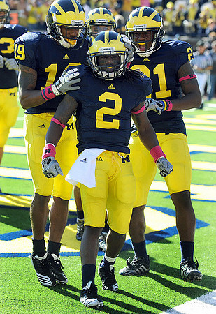 Rocko Khoury (63), Kelvin Grady (19), Vincent Smith (2), and Junior Hemingway (21)