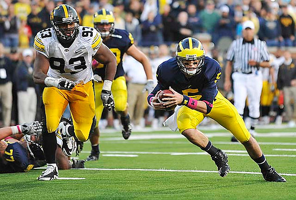 Taylor Lewan (77), Rocko Khoury (63), and Tate Forcier (5)