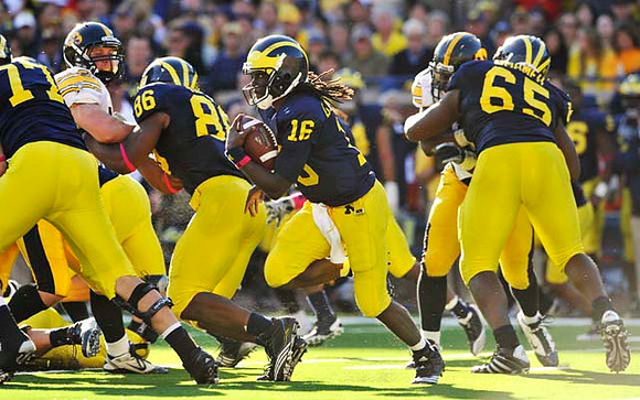 Taylor Lewan (77), Kevin Koger (86), Denard Robinson (16), and Patrick Omameh (65)