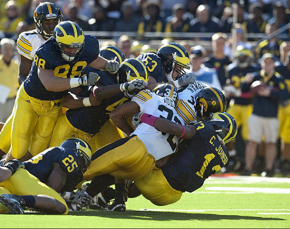 Kenny Demens (25), Craig Roh (88), Cameron Gordon (4), Ryan Van Bergen (53), and Carvin Johnson (13)