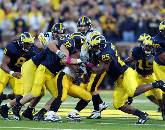 Jonas Mouton (8), Ryan Van Bergen (53), Jordan Kovacs (32), Kenny Demens (25), Thomas Gordon (15), and Greg Banks (92)