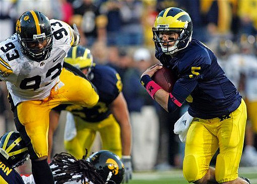 Taylor Lewan (77), Rocko Khoury (63), and Tate Forcier (5)