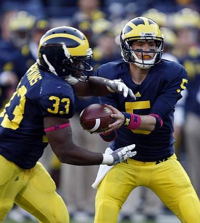 Stephen Hopkins (33) and Tate Forcier (5)