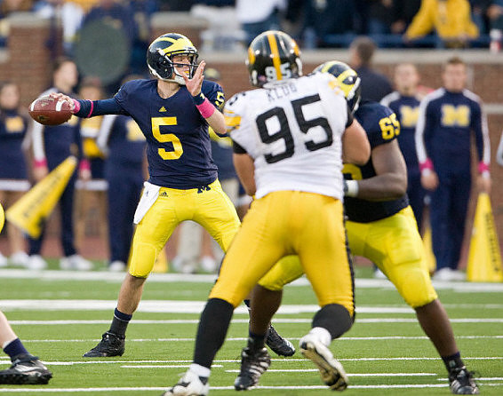 Tate Forcier (5) and Patrick Omameh (65)
