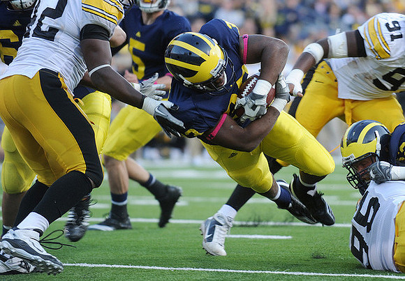 Patrick Omameh (65), Tate Forcier (5), Stephen Hopkins (33), and Stephen Schilling (52)