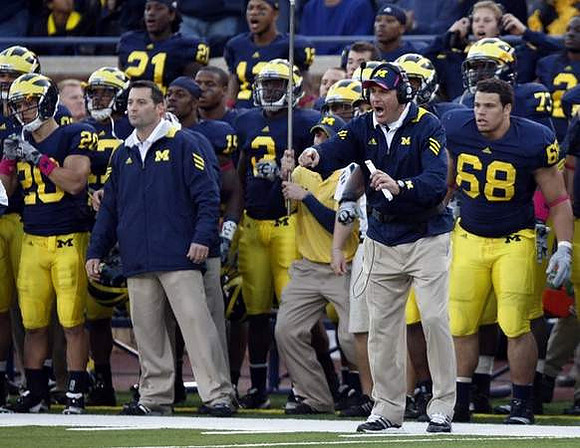 Ray Vinopal (20), Mike Barwis, Marvin Robinson (3), Thomas Gordon (15), Rich Rodriguez, William Campbell (73), and Mike Martin (68)
