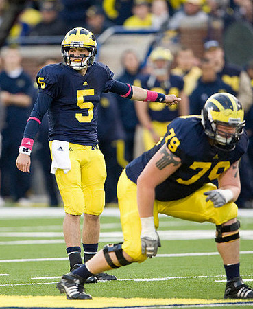 Tate Forcier (5) and Perry Dorrestein (79)