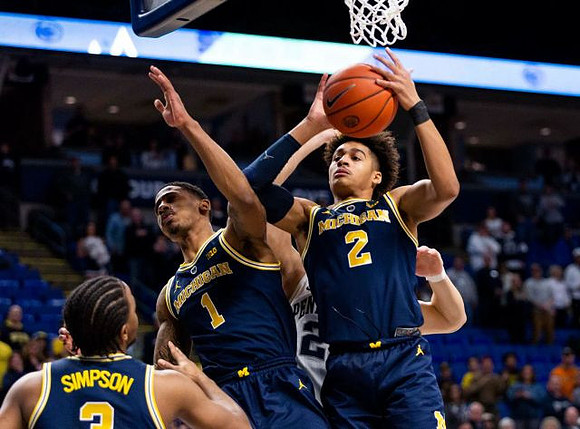 Zavier Simpson (3), Charles Matthews (1), and Jordan Poole (2)