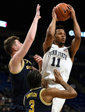 Jon Teske (15) and Zavier Simpson (3)